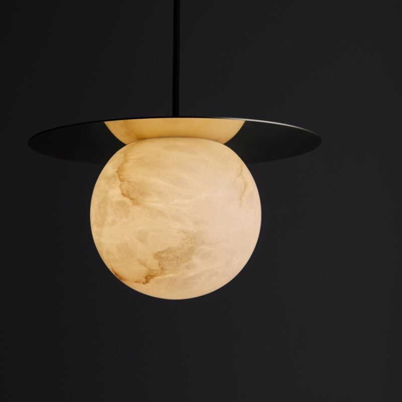 Alabaster Sphere Pendant Light Above Bed